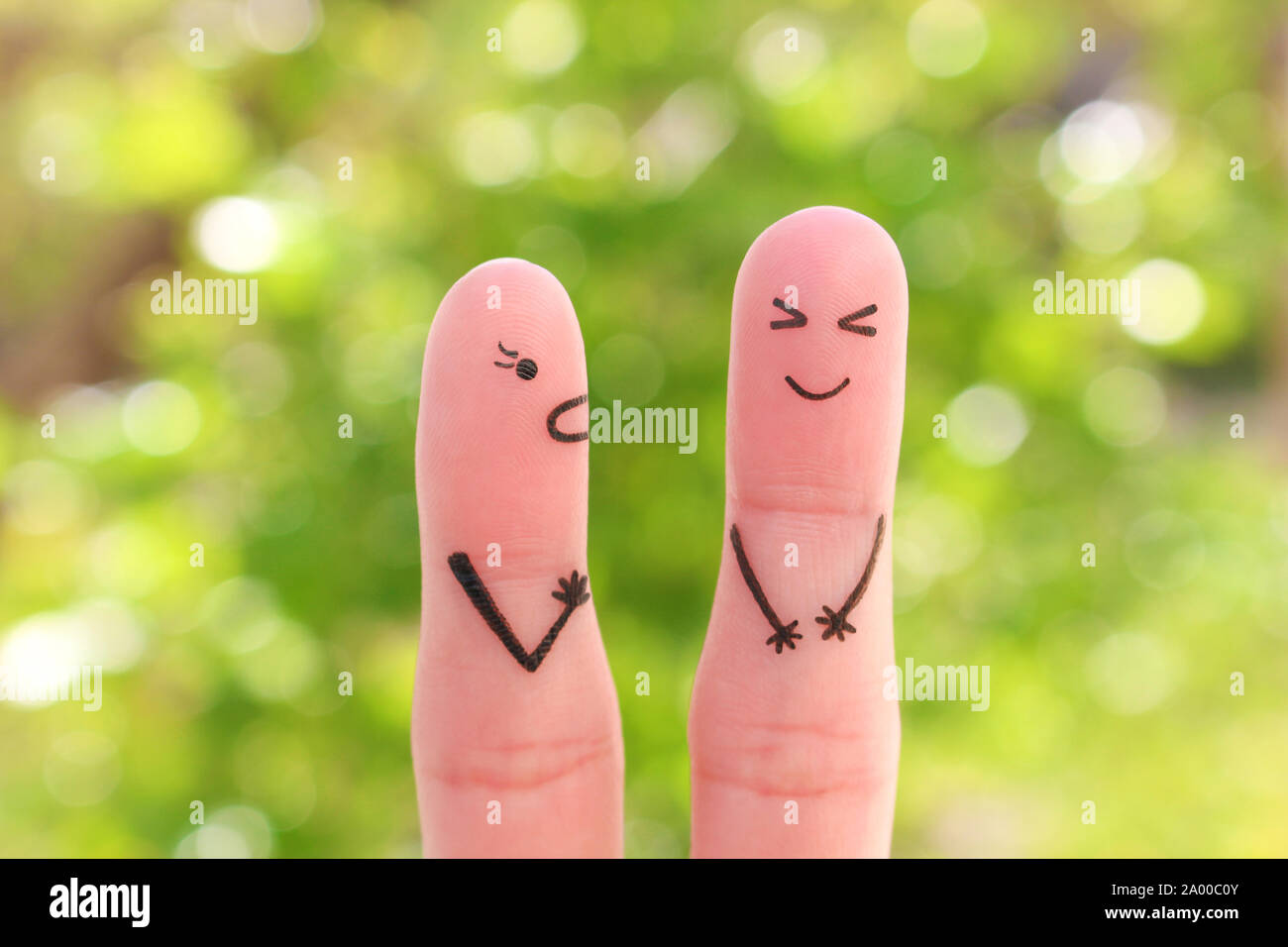 Fingers art of family during quarrel. Concept of wife shouts on husband, man laughs. Stock Photo