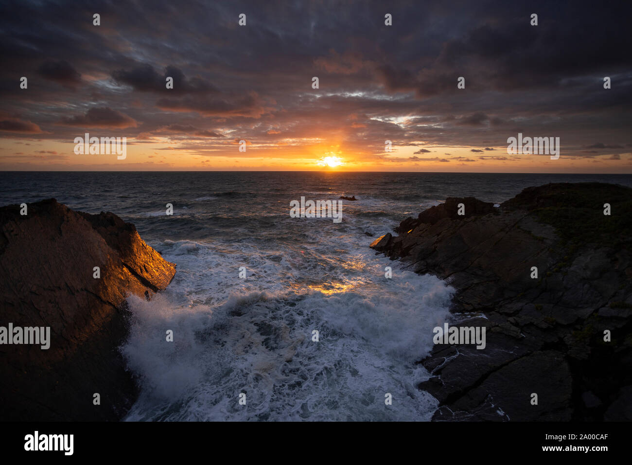 Sunset over the Atlantic ocean at Hartland Quay, Devon, England Stock Photo