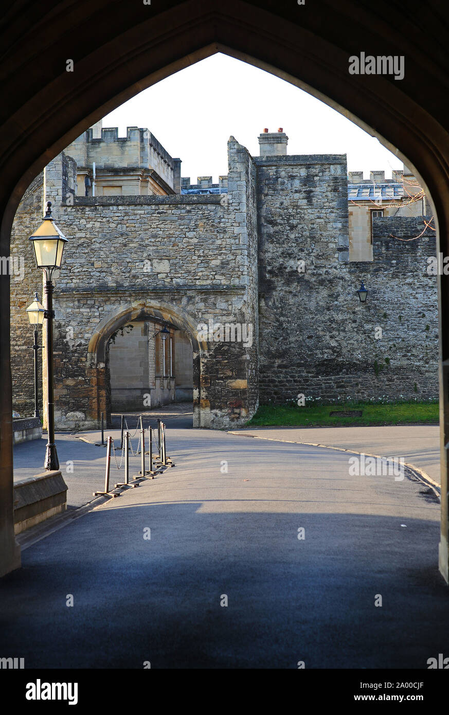 archway in the Robinson Tower and back entrance gate to New College Oxford showing part of the old city walls inside the grounds of the college Stock Photo