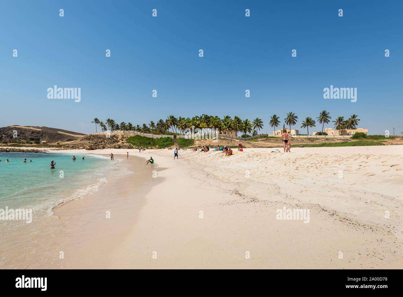 Salalah, Oman - November 12, 2017: People are resting and relaxing on the sunny Oasis Beach in Oman, Indian Ocean. Stock Photo