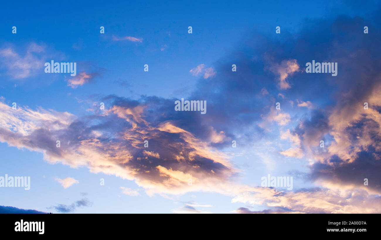 clouds in a colorful evening sky at sunset, sky only Stock Photo