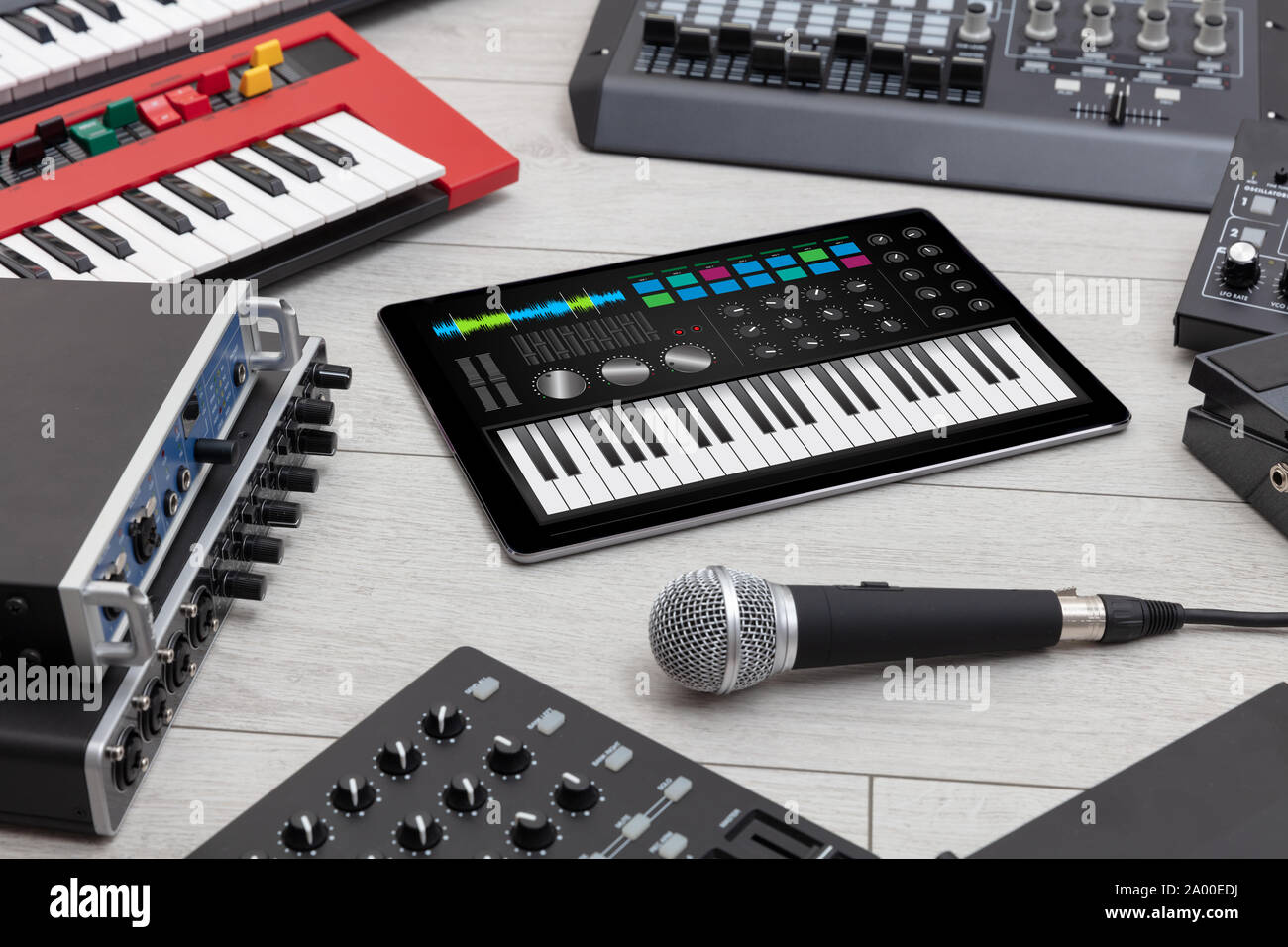 Piano synthesizer app on tablet and musical instrument concept Stock