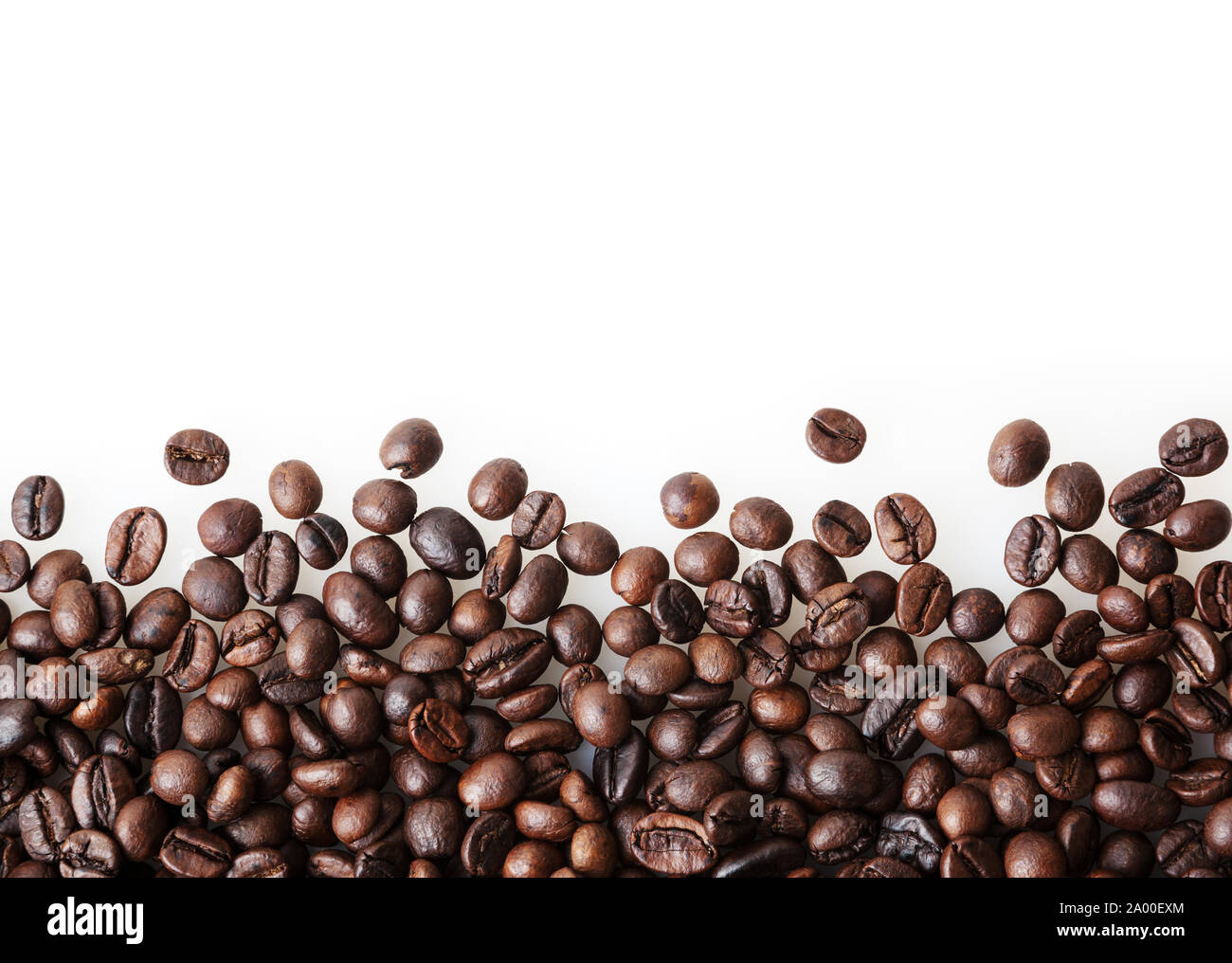 Roasted coffee beans on white background with copy space Stock Photo ...