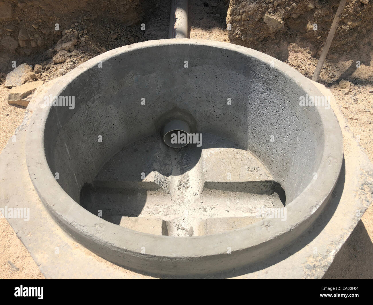 Storm water drainage reinforced concrete wells in the dug trench. Water