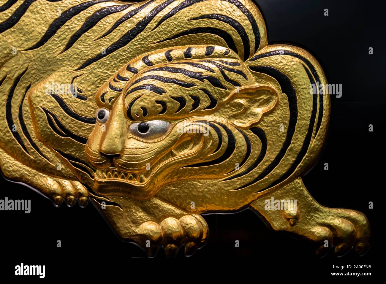 Fukuku, Japanese relief, golden tiger figure, Osaka Castle, Osaka, Japan Stock Photo