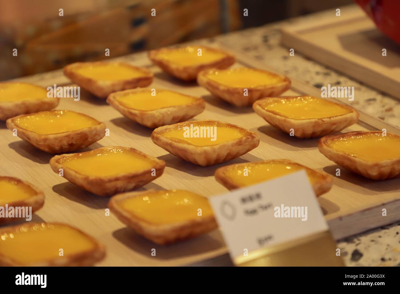 Tong Heng's egg tarts, popular diamond-shaped egg tart in Singapore, on display at the store window in its Chinatown store. Stock Photo