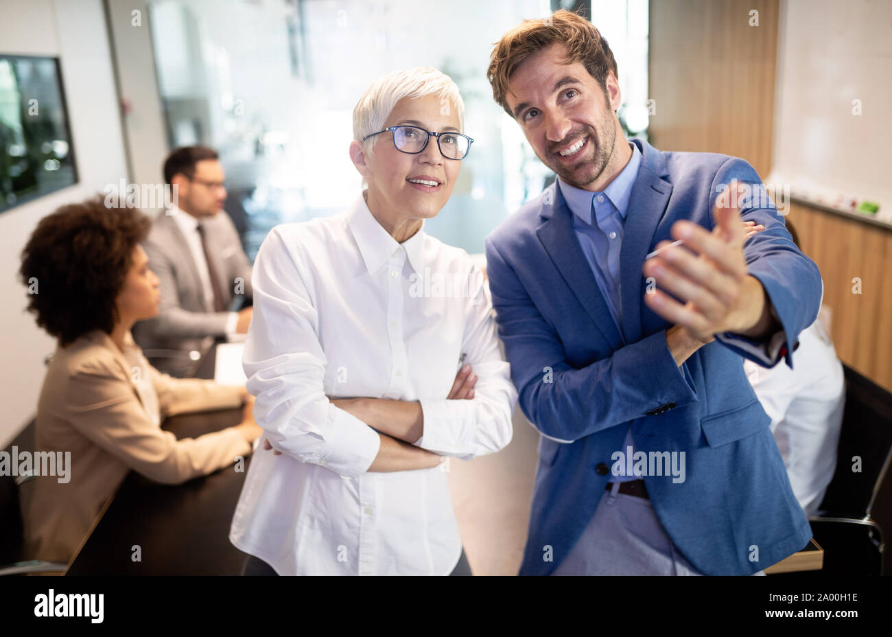 Group of successful business people at work in office Stock Photo - Alamy