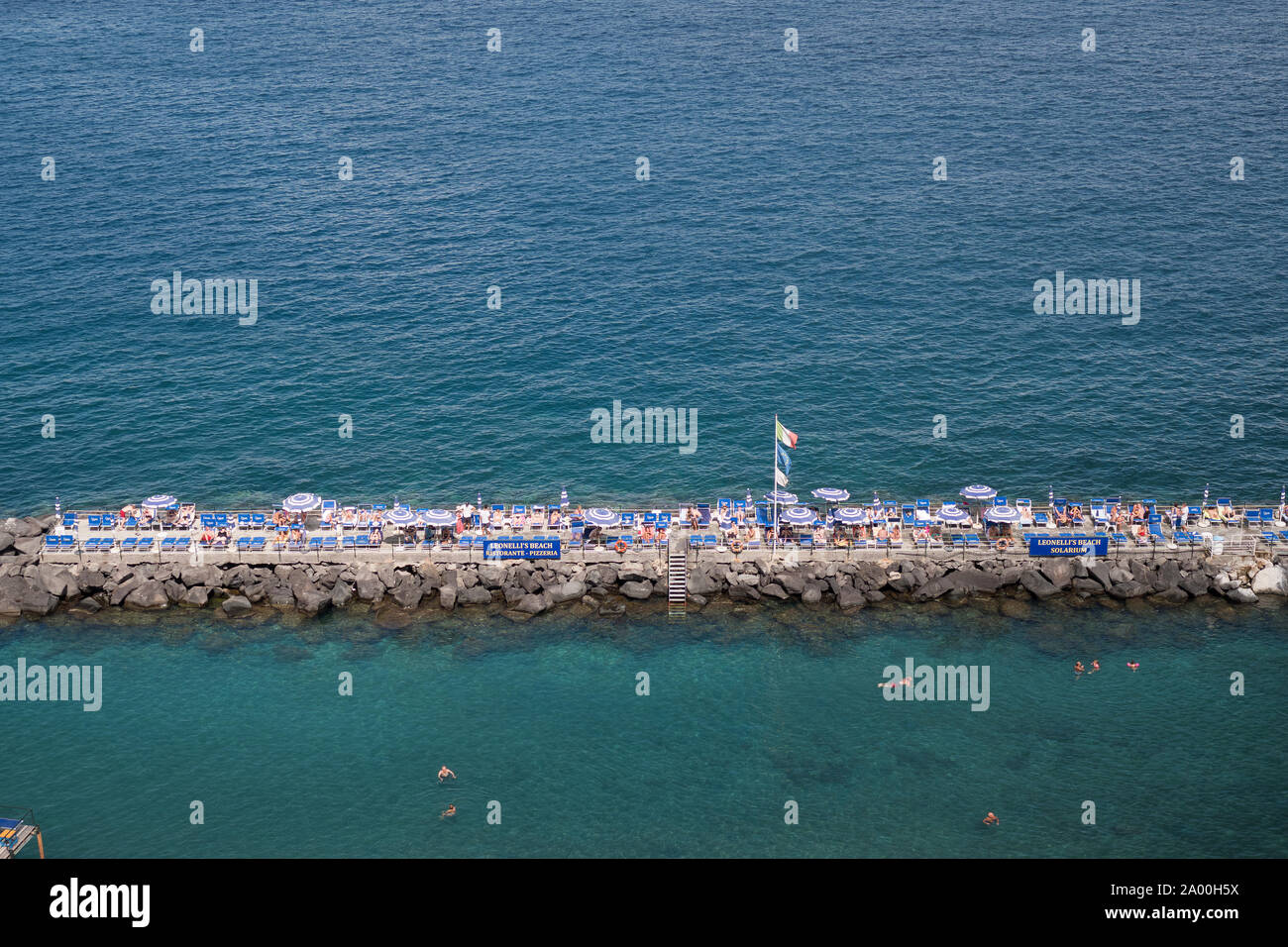 Sunbathers in Sorrento in Italy Stock Photo