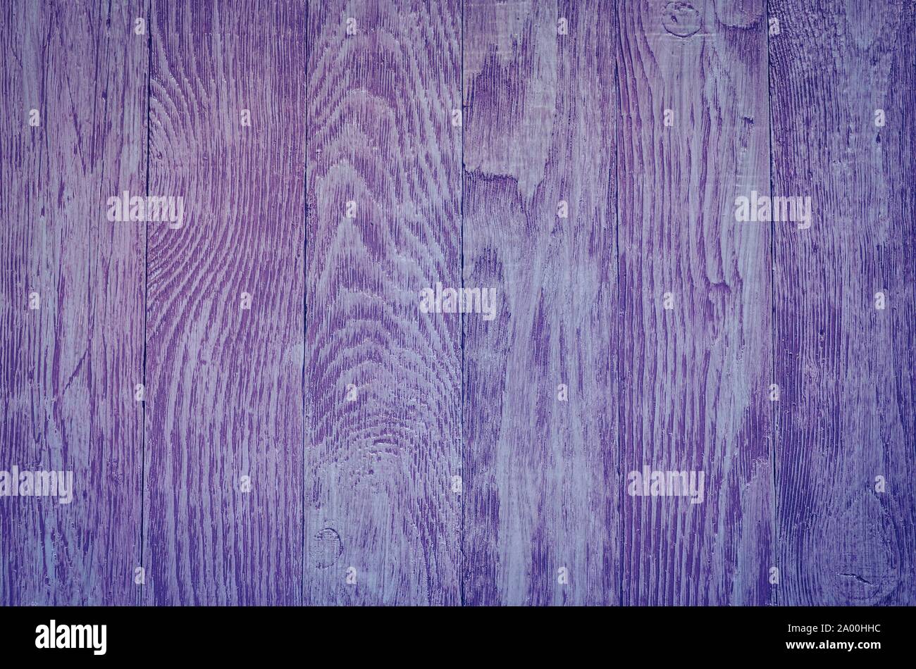 Wooden background texture. Creatively painted intense violet boards. Stock Photo