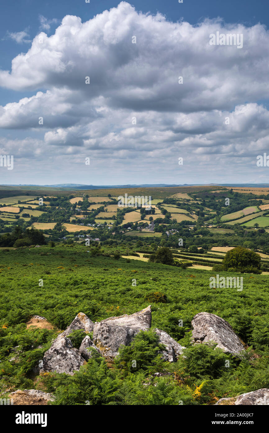 Spectacular far-reaching views over picturesque Dartmoor in Devon - rocks, blue sky and puffy clouds, England, UK Stock Photo