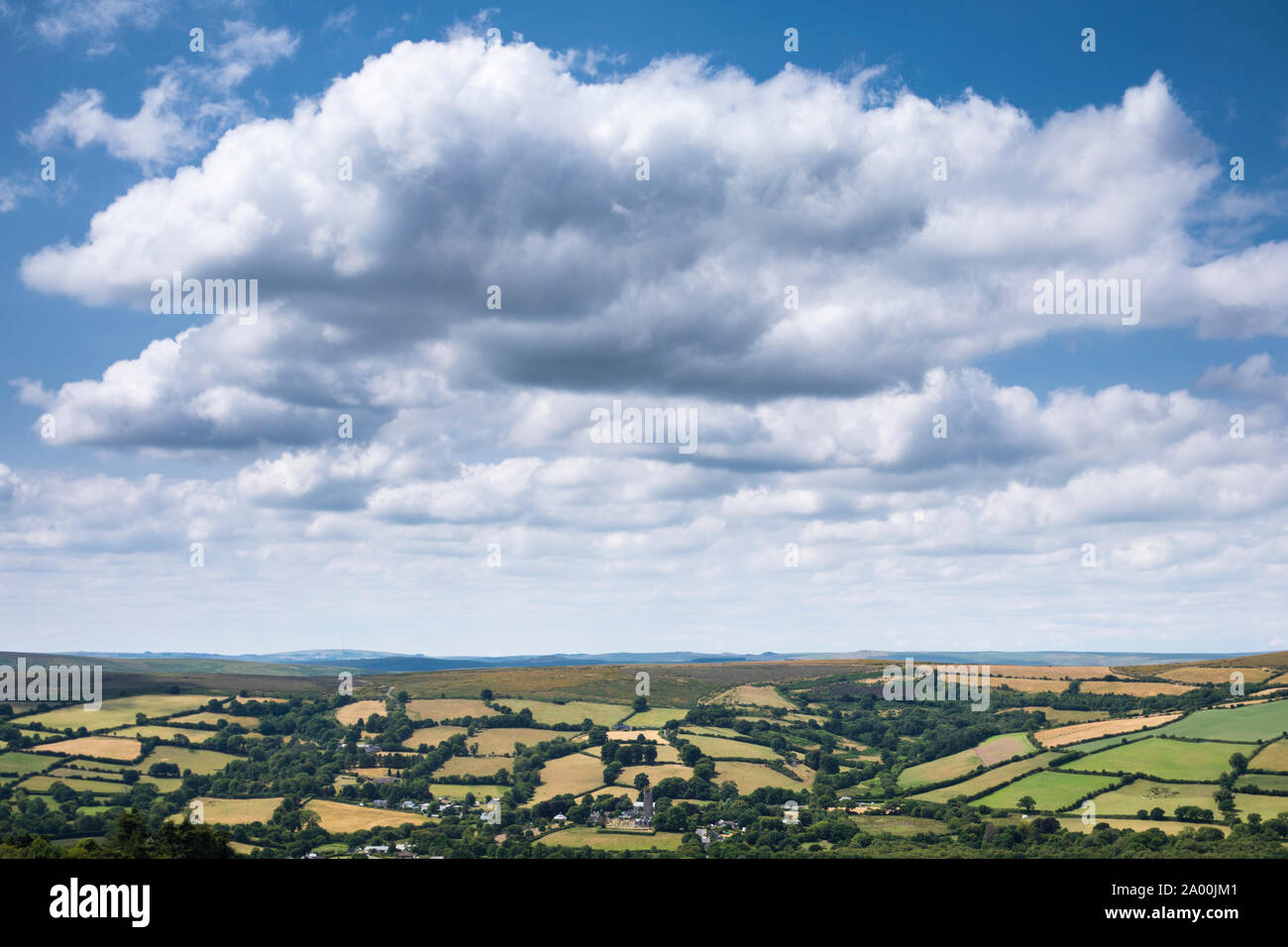 Spectacular far-reaching views over picturesque Dartmoor in Devon with blue sky and puffy clouds in Southern England, UK Stock Photo