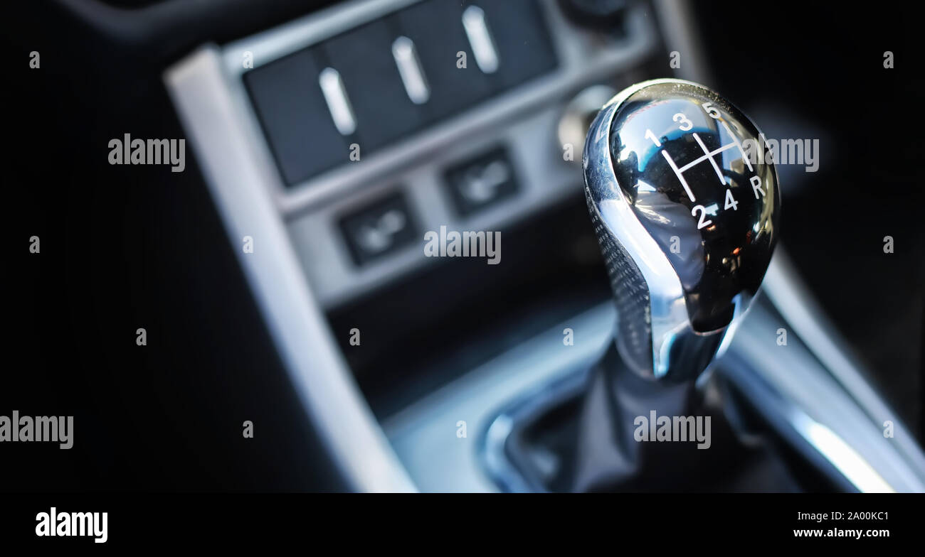 Gear lever. Manual Transmission. Hand on the gear shift in the car