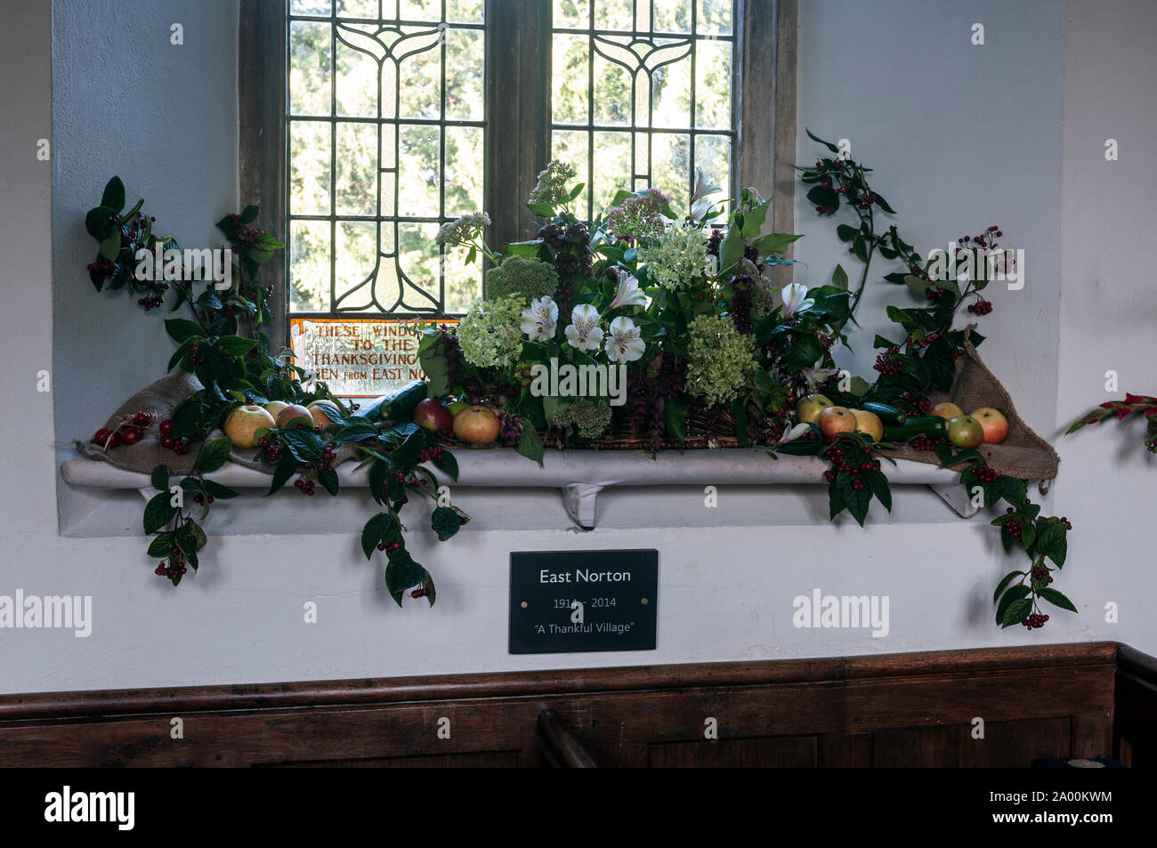 Harvest festival flowers in All Saints Church, East Norton, Leicestershire, England, UK Stock Photo