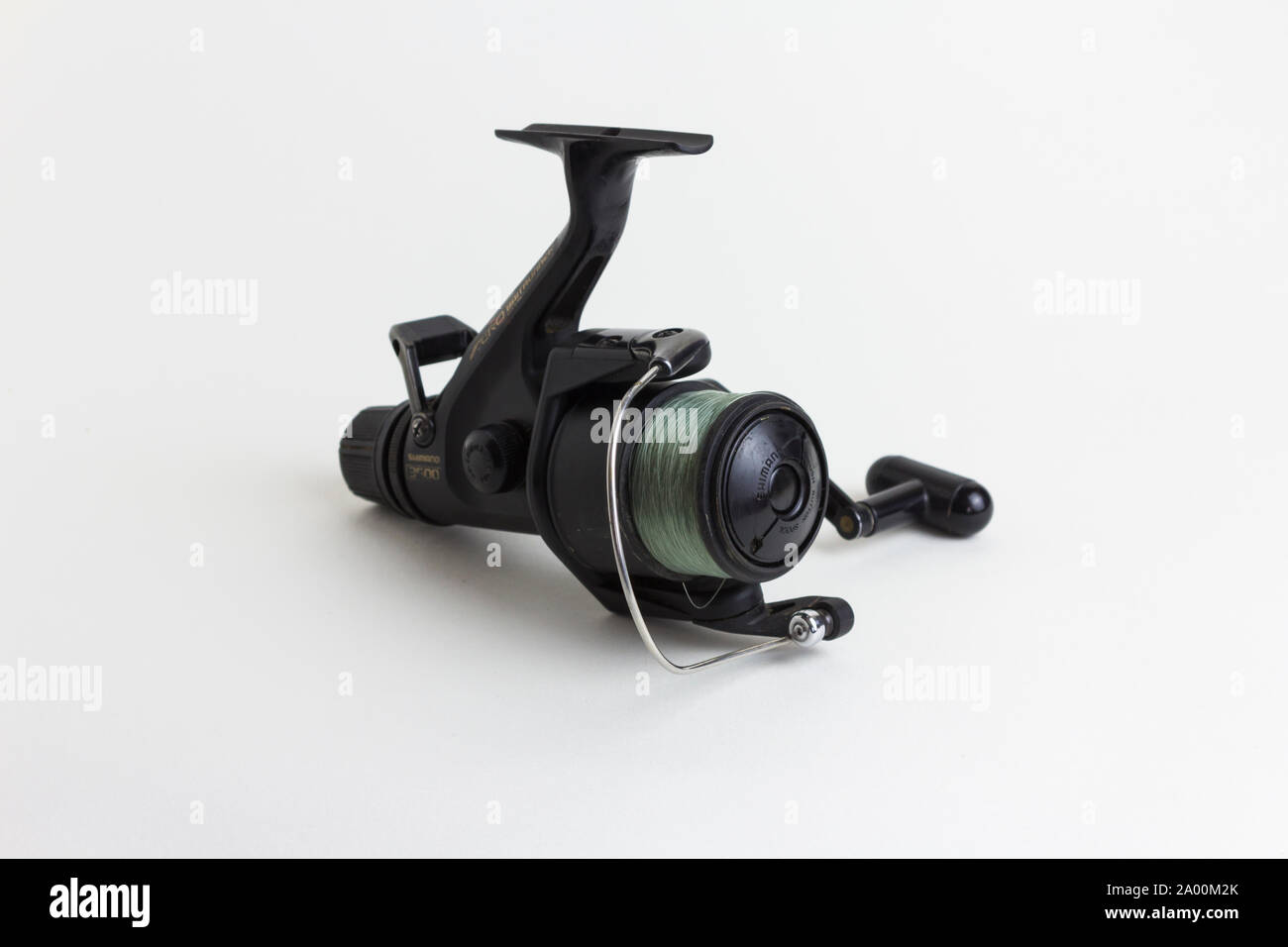 Shimano Aero 3500 baitrunner fixed spool fishing reel with a light  breaking-strain fishing line on the spool. White background Stock Photo -  Alamy