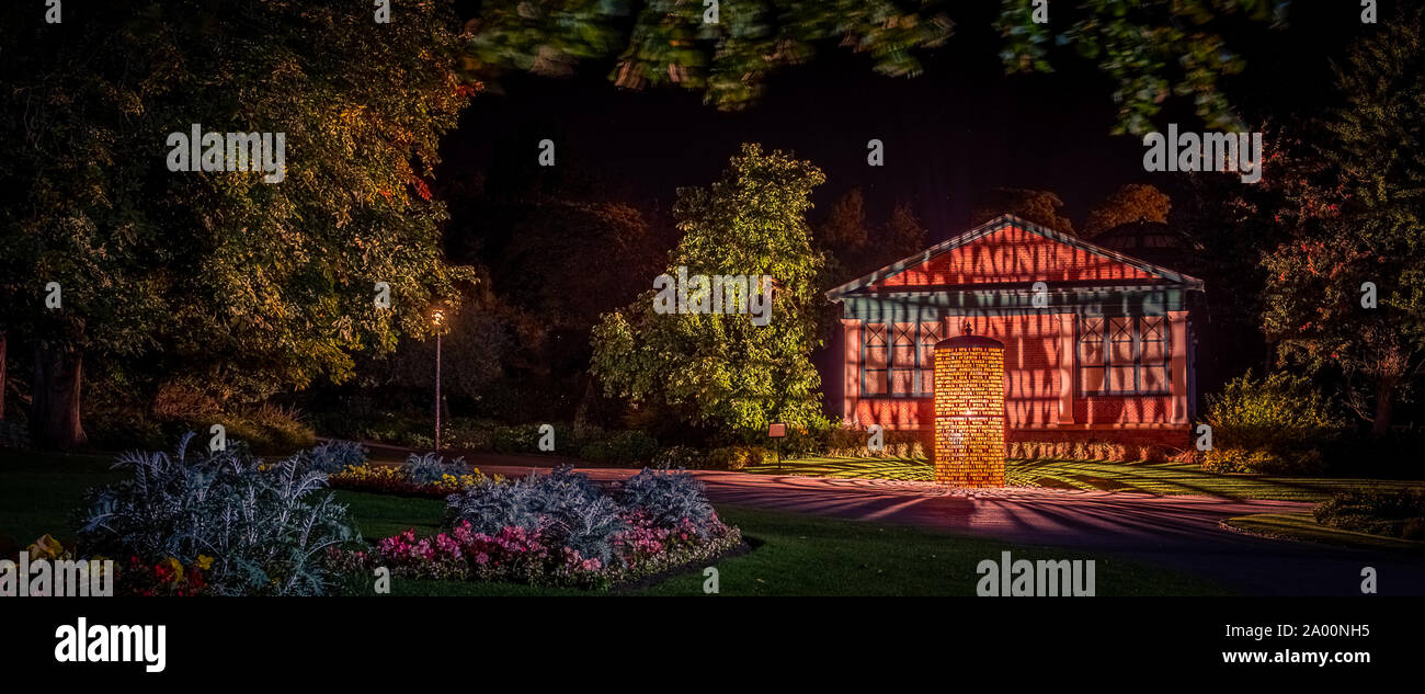 Valley Gardens, Harrogate, United Kingdom. 18th September, 2019. Eddie Roberts' sculpture is lit up overnight in the Valley Gardens, celebrating the heritage of the town and welcomes the world as the UCI World Championships take place between 21 to 29 September 2019 in and around Harrogate North Yorkshire, UK. Credit: Caught Light Photography/Alamy Live News. Stock Photo
