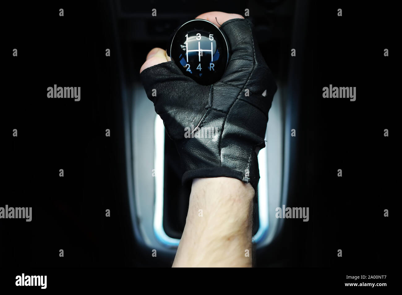 Gear lever. Manual Transmission. Hand on the gear shift in a car Stock