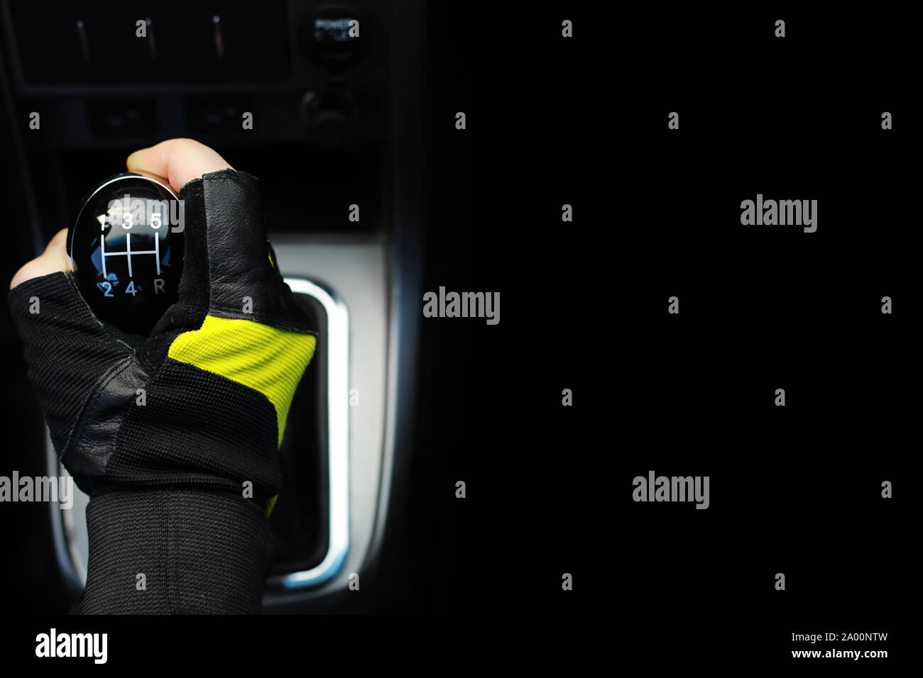 Gear lever. Manual Transmission. Hand on the gear shift in a car Stock