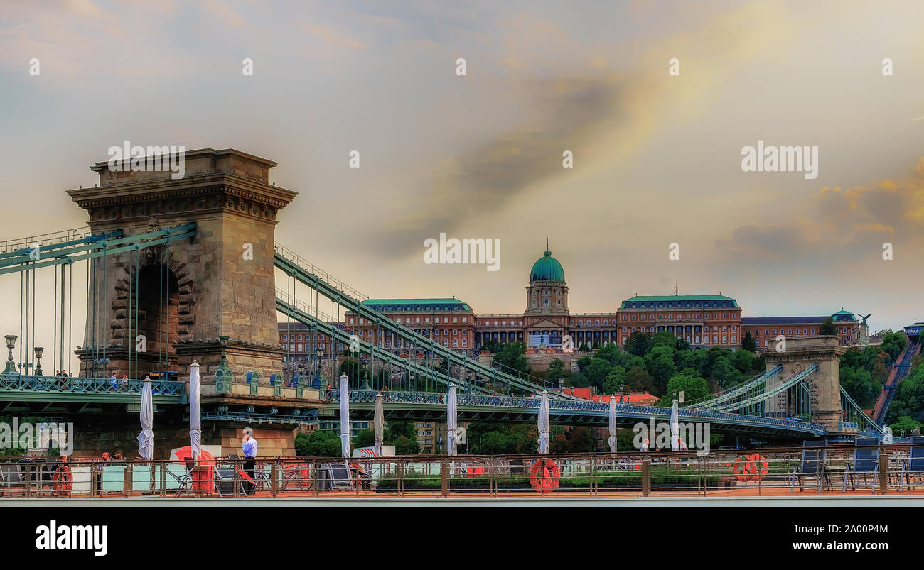 Budapest, Hungary, Aug 2019, view of the top deck of a Viking River Cruises boat on the Danube River opposite the Szechenyi Chain Bridge and the Buda Stock Photo
