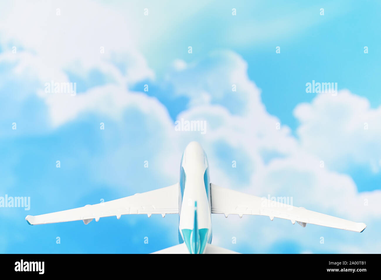 The plane flies in the sky above the clouds Stock Photo - Alamy