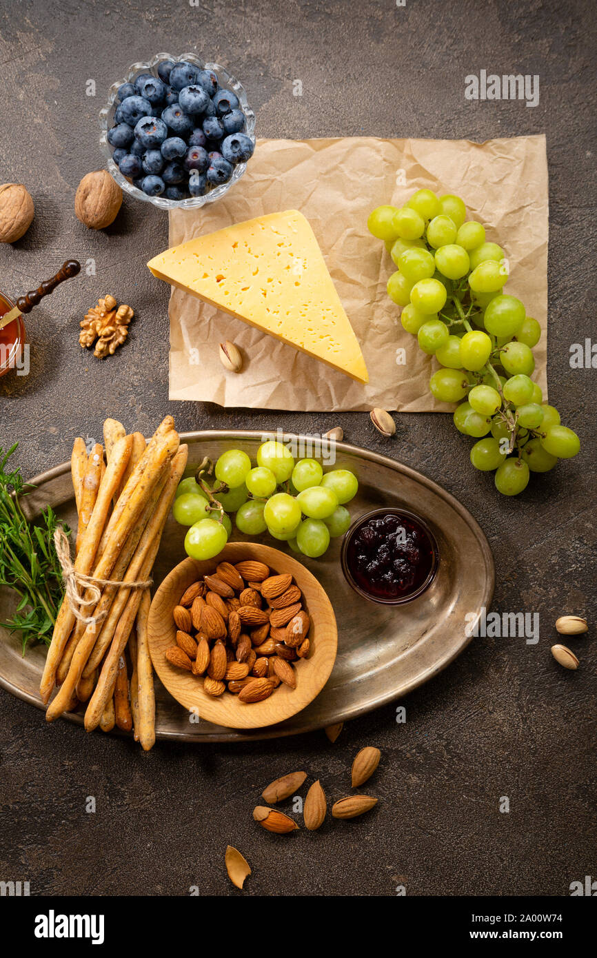 Healthy food background, cheese and nuts Stock Photo - Alamy
