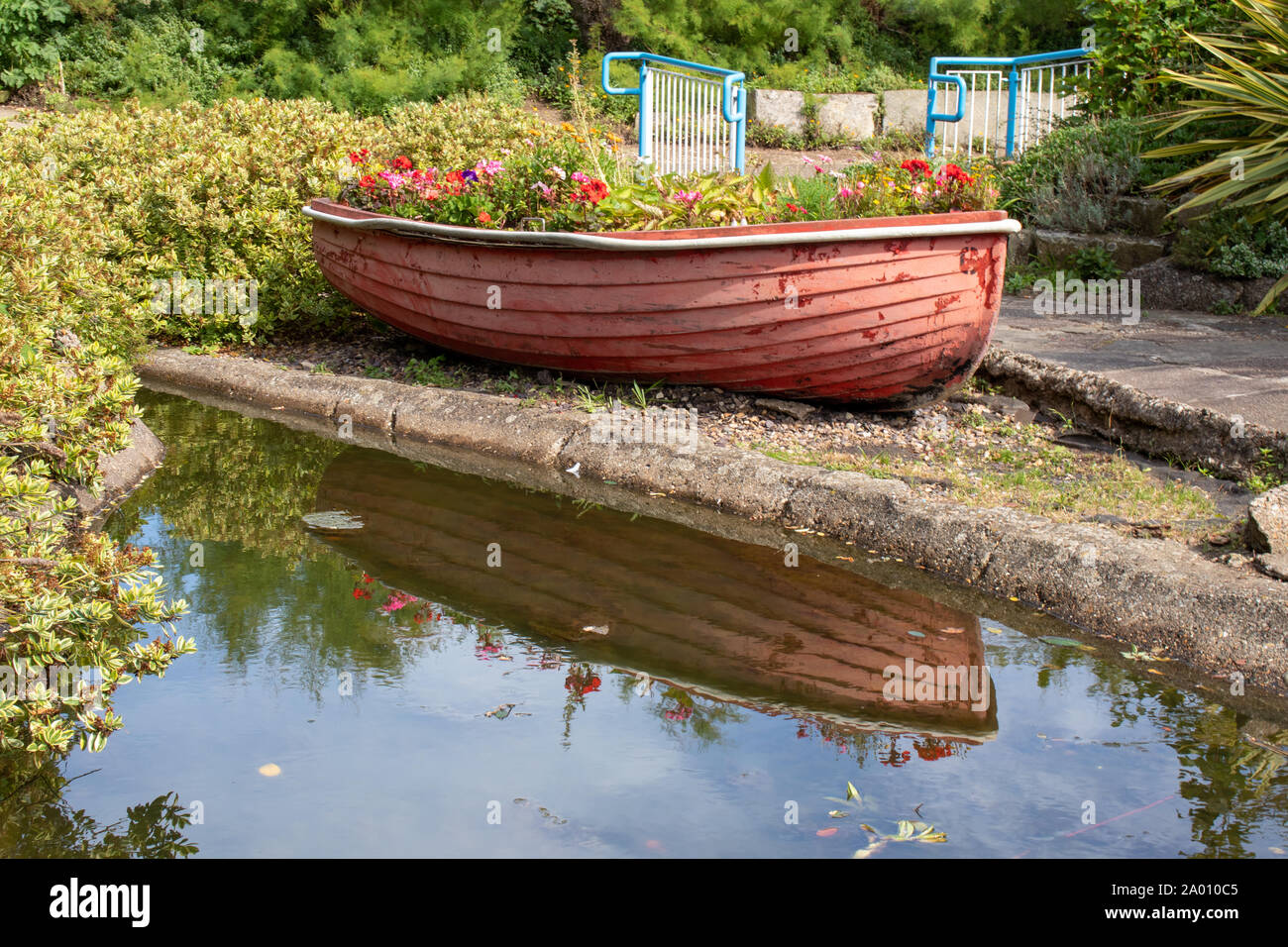 Flowerbed Boat and Reflection Stock Photo
