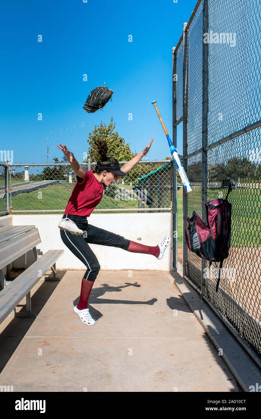 Female teenager softball player has softball gear exploded out of her ...