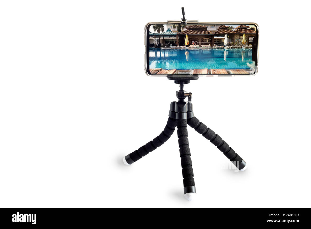 Smartphone and smartphone tripod on white background. Stock Photo