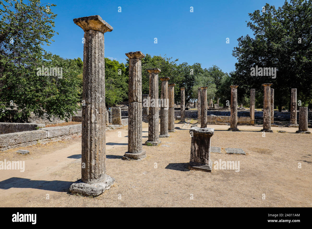 Olympia, Elis, Peloponnese, Greece - Ancient Olympia, here colonnades with Doric columns of the wrestling school Palaestra.  Olympia, Elis, Peloponnes Stock Photo