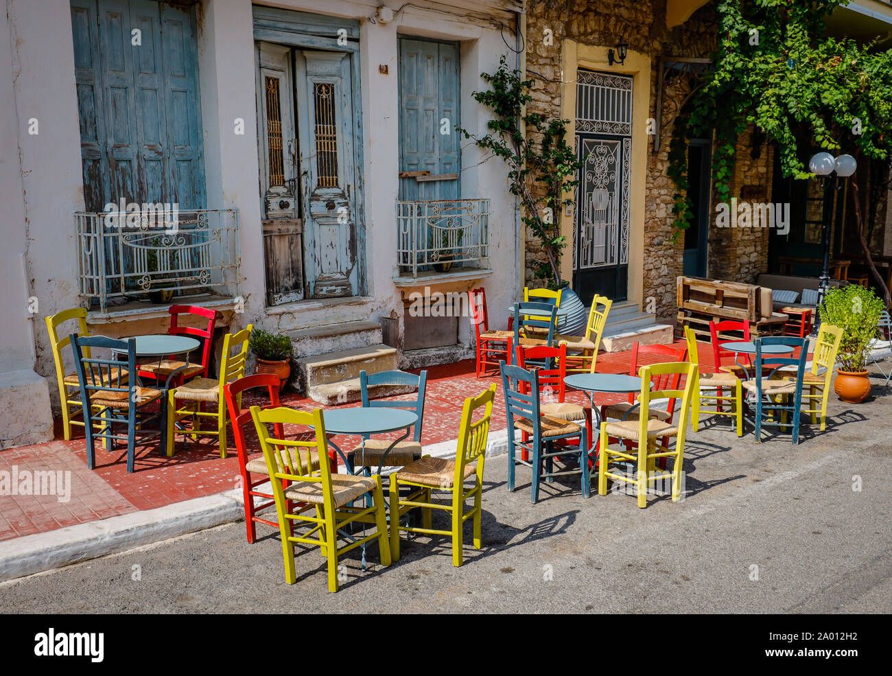 Kyparissia, Messinia, Peloponnese, Greece - Colourful chairs and tables, street cafes and restaurants in the old town.  Kyparissia, Messenien, Pelopon Stock Photo