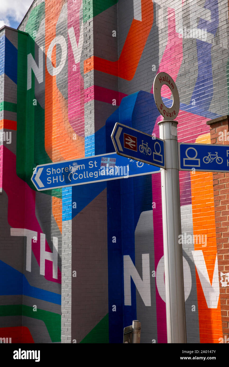 UK, Yorkshire, Sheffield, Arundel Street, Hallam Square pedestrian signpost in front of colourful gable end mural Stock Photo