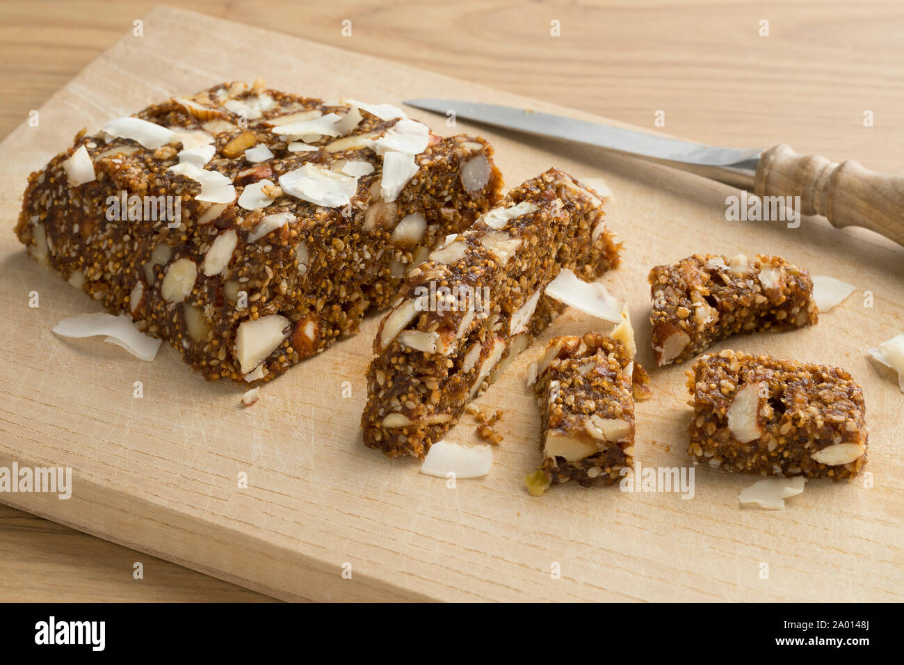 Turkish fig, fruit and nut cake pieces on a cutting board Stock Photo