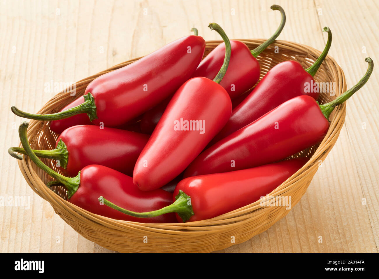 Basket with fresh red Jalapeno peppers Stock Photo