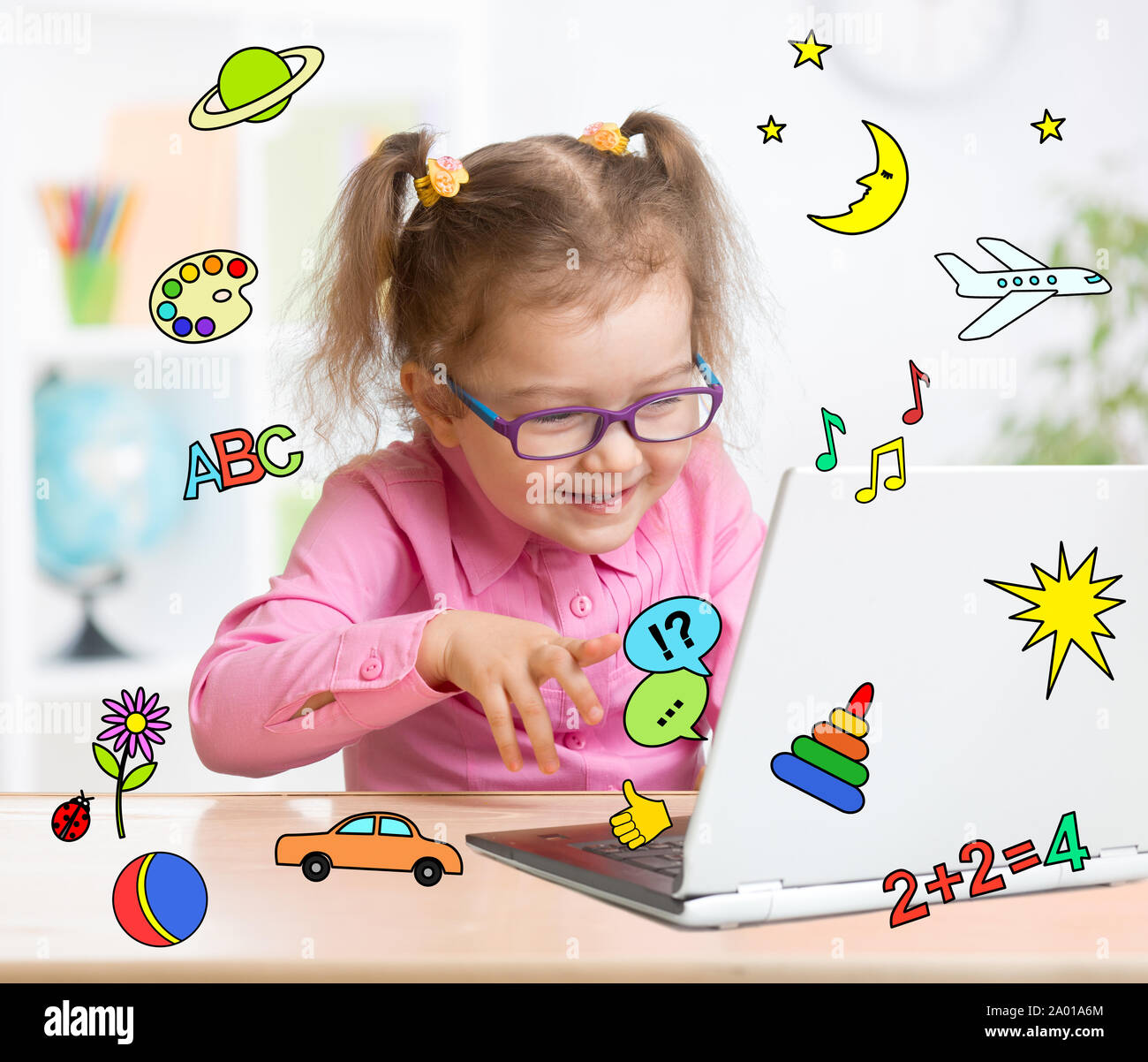 Kid using notebook actively in education and entertainment Stock Photo