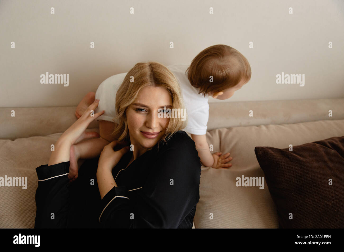 Young Blonde Mother Having Quality Time With Her Baby Boy Son At