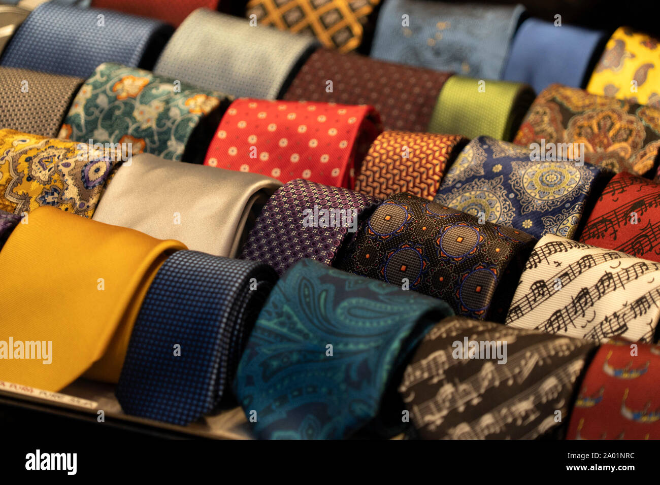 different colors silk tie on display stand Stock Photo