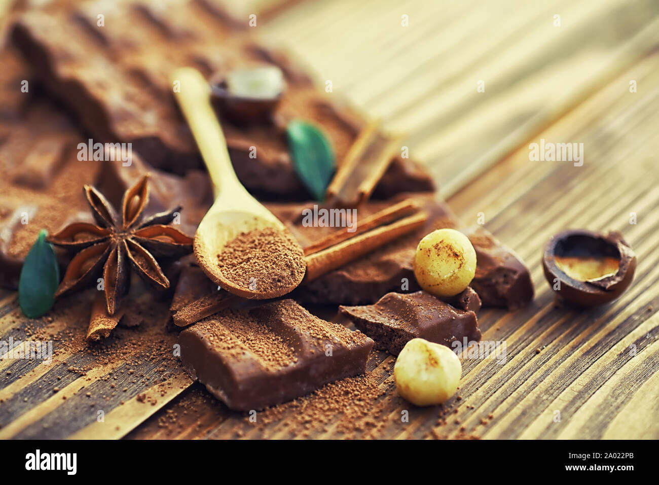 A bar of milk chocolate on the table. Chocolate with nuts and cinnamon
