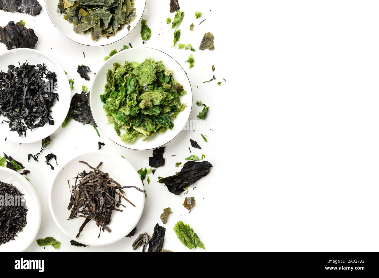 Dry seaweed, sea vegetables, shot from the top on a white background with copy space, a design template with a flat lay composition Stock Photo
