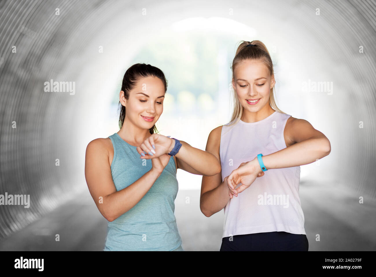 women or female friends with fitness trackers Stock Photo Alamy