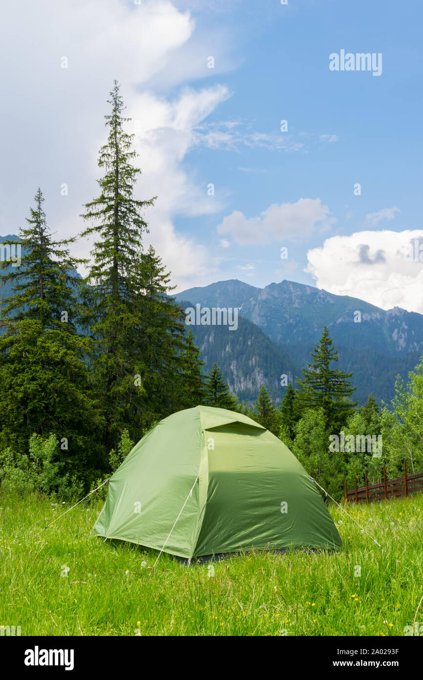 one green tent installed in the wild mountain scenery Stock Photo - Alamy