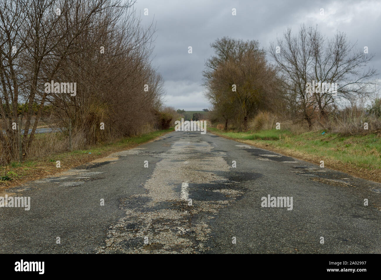 Broken road surface in Portugal Stock Photo