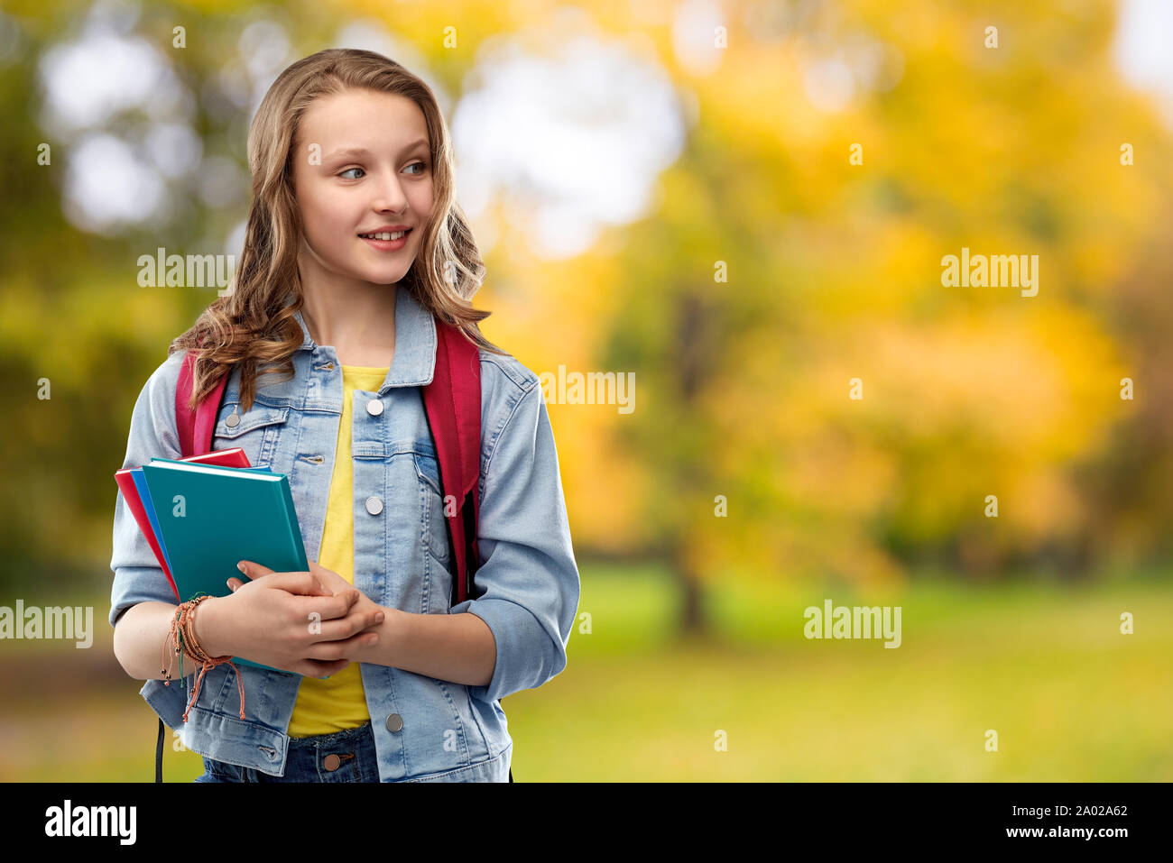 happy smiling teenage student girl with school bag Stock Photo - Alamy