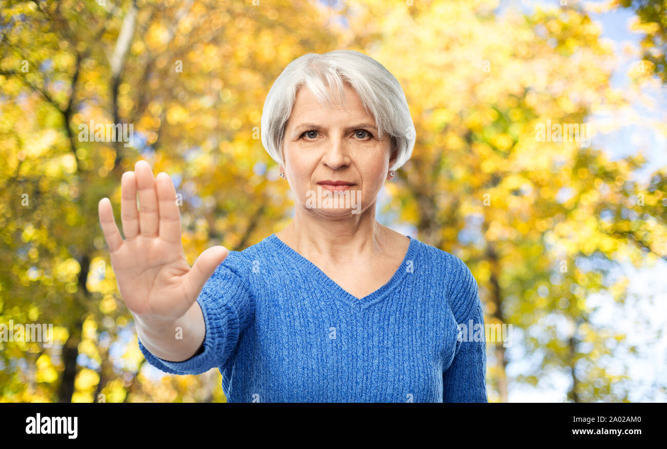 Stop sign woman senior hi-res stock photography and images - Alamy