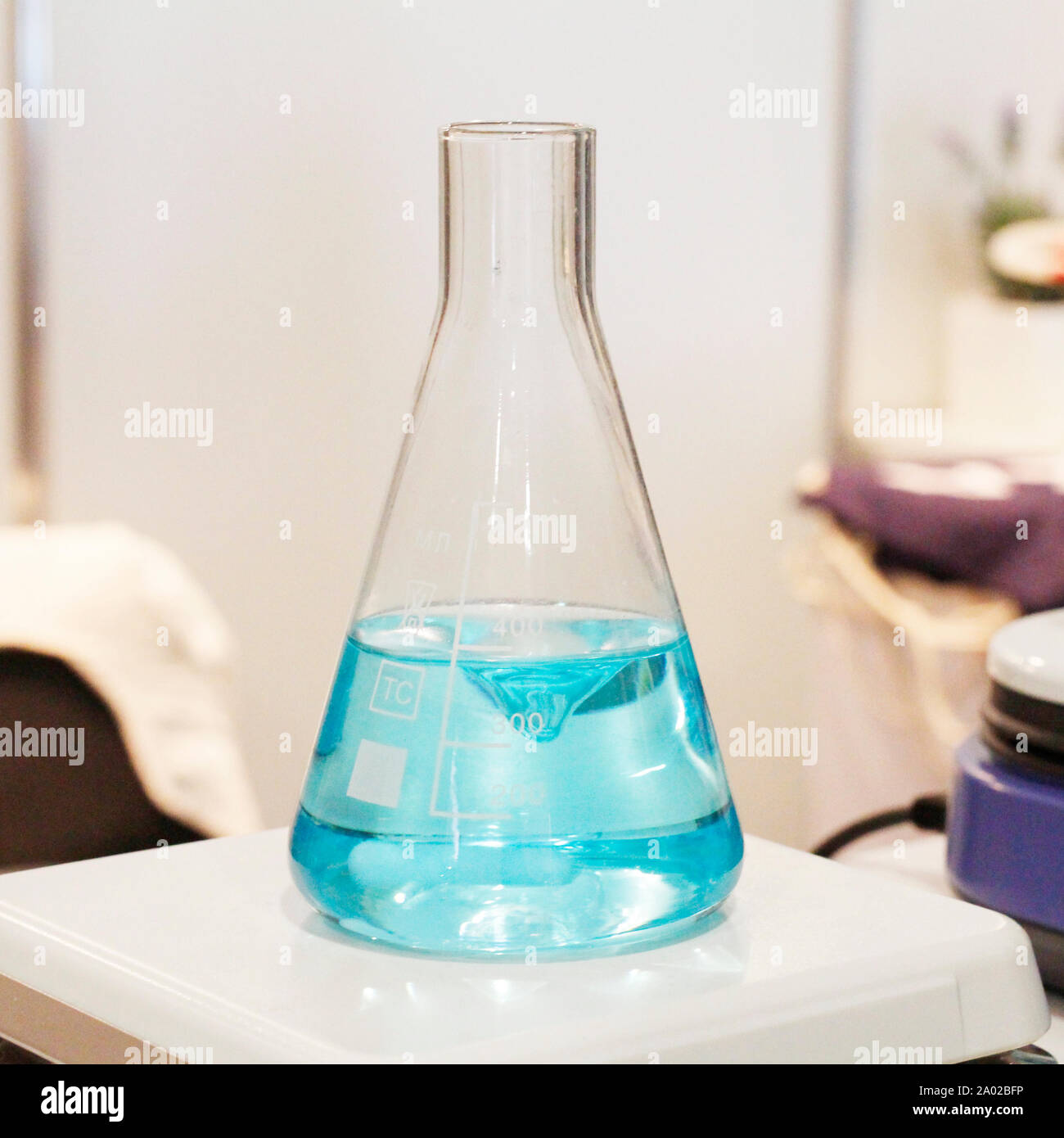 Chemical laboratory. Flasks and dishes with solutions ready for
