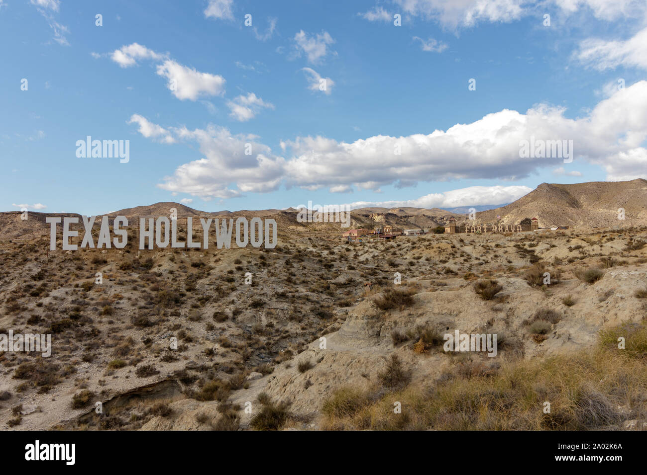Almeria / Spain - January 26 2018: Texas Hollywood sign in Almeria Spain seen from a far with Fort Bravo behind it Stock Photo