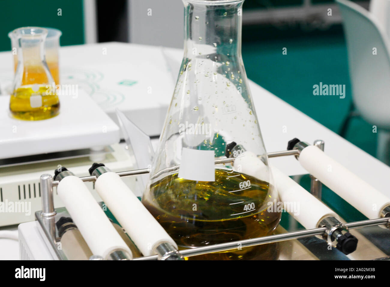 Chemical laboratory. Flasks and dishes with solutions ready for research activities. Laboratory test tubes and flasks. Stock Photo