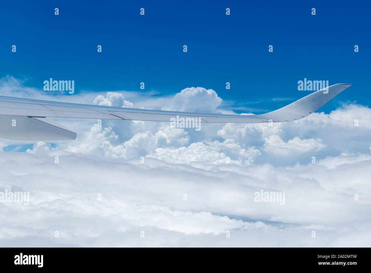 Airplane in white clouds hi-res stock photography and images - Alamy
