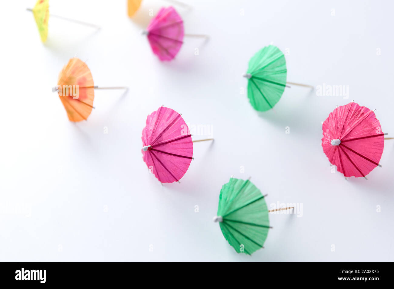 cocktail umbrellas on white background Stock Photo