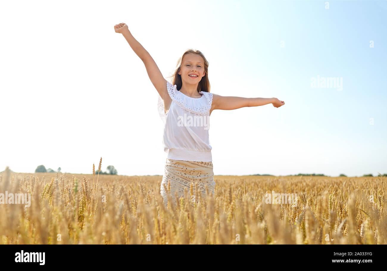 happy smiling young girl on cereal field in summer Stock Photo - Alamy
