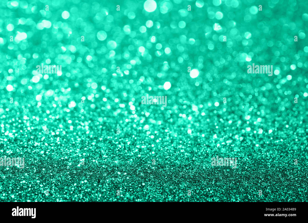 Abstract composition. Mint green glitter light background with beautiful bokeh Stock Photo