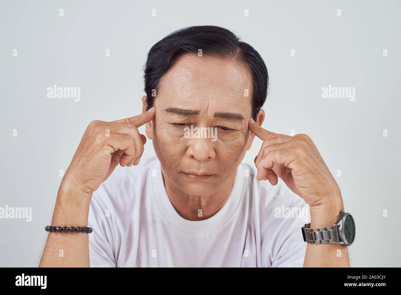 Asian elder suffer from stroke and powerful headache or brain attack Stock Photo